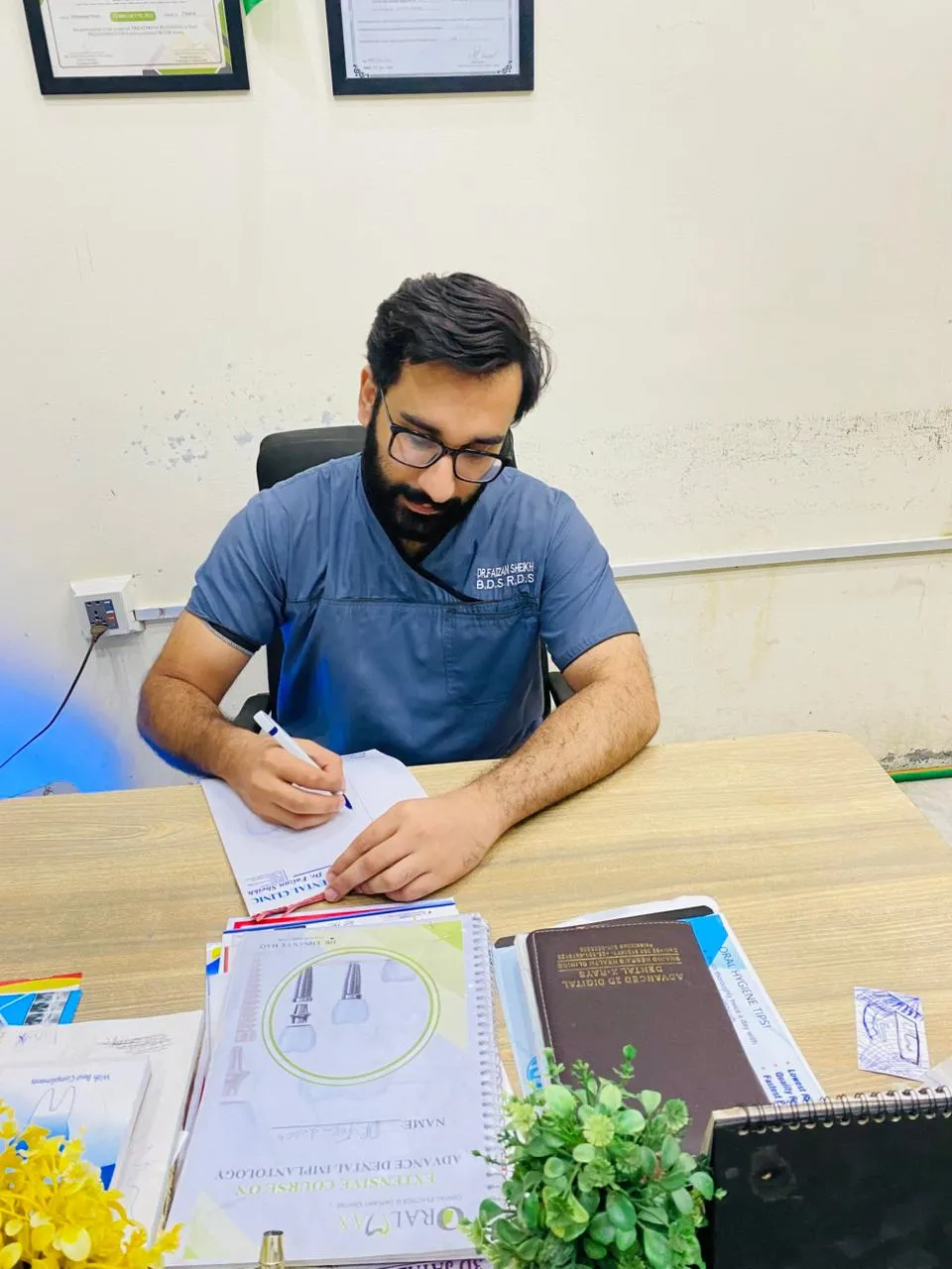Dr. Muhammad Faizan Sheikh planning an implant case at The Perfect Smile Dental Clinic, Faisalabad
